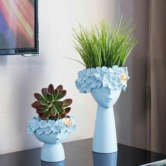 set of two half face Vases