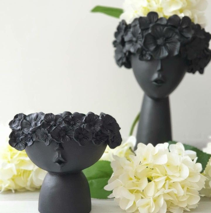 set of two half face Vases