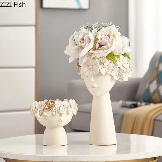 set of two half face Vases